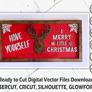以下が含まれることがあります： 「Have Yourself A Merry Little Christmas」という文字と、白いシルエットのトナカイが描かれた赤い木製の看板。看板は茶色の木枠で囲まれています。