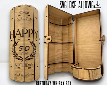 May include: A wooden box with a hinged lid, designed to hold a bottle of whiskey. The box is engraved with the text "Since 1974", "Happy 50th Birthday", and "Aged to perfection".