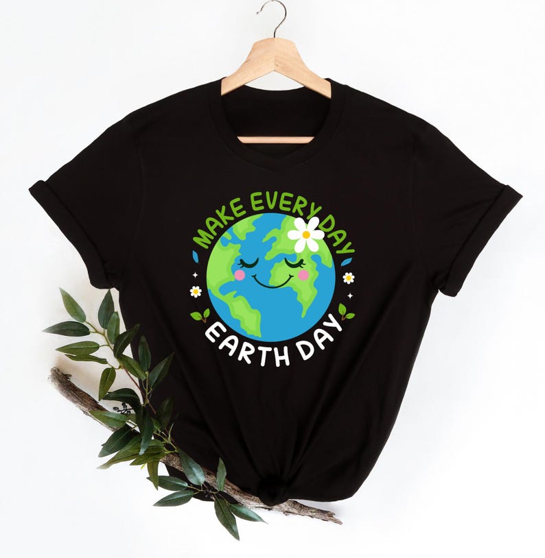 May include: Black t-shirt with a green and blue cartoon Earth with a smiling face and a white flower. The text "Make Every Day Earth Day" is written around the Earth.
