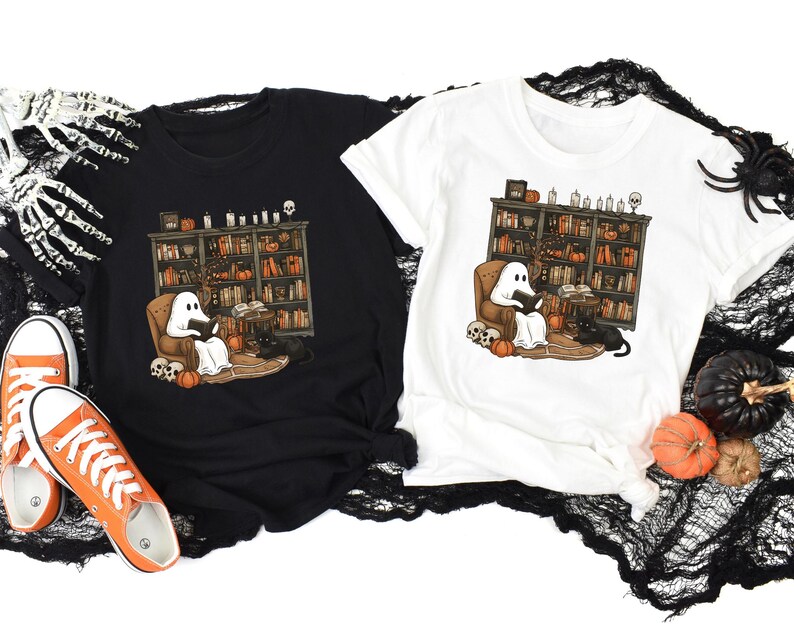 a couple of t - shirts sitting on top of a table
