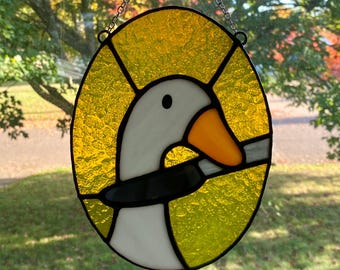 Ganso tonto con cuchillo, atrapasueños de vidriera