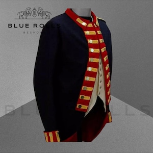 May include: A navy blue military jacket with red and gold trim. The jacket has a stand-up collar and a double-breasted closure. The jacket is lined with a white fabric. "BLUE ROLLS BESPOKE" is printed on the jacket.