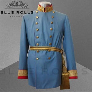 May include: A blue military uniform with gold buttons and trim. The uniform has a high collar with a red and gold trim. The uniform is worn by a mannequin and has a gold belt with a tassel.