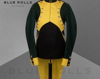 May include: A green and yellow military-style jacket with gold buttons. The jacket has a high collar and a long tail. The jacket is on a mannequin.