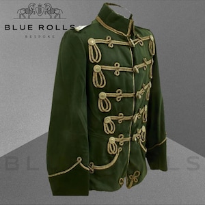 May include: A dark green military-style jacket with gold braid trim and buttons. The jacket has a high collar and a fitted silhouette.