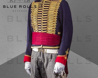 May include: A navy blue jacket with gold braid trim and red accents. The jacket has a high collar and a stand-up collar. The jacket is worn over a white shirt and a red sash. The jacket is part of a military uniform.