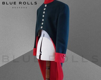 May include: A dark green and red tailcoat with a high collar and button closures. The coat has a long, flowing tail and is made of a thick, luxurious fabric.