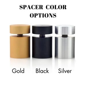May include: Image showing three cylindrical spacers in gold, black, and silver. The text at the top reads "SPACER COLOR OPTIONS." Below each spacer is the color name: "Gold," "Black," and "Silver."