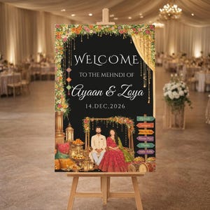 May include: A wooden easel displays a black sign with floral and gold accents. The sign reads "WELCOME TO THE MEHNDI OF Ayaan & Zoya 14.DEC.2026." Below is an illustration of a couple. Colorful directional signs are on the right.