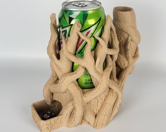 May include: A 3D printed brown tree-shaped holder with a can of Mountain Dew inside and a small compartment for dice.