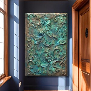 May include: A rectangular wall art piece with a detailed, raised floral design in shades of teal and bronze. The artwork is mounted on a dark blue wall, with a wooden door and window visible in the background. The art piece adds a touch of elegance to the space.