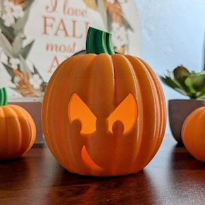 Smirking Halloween Jack O&#39;Lantern pumpkin with LED tea light, 2 sizes.  Fun indoor Halloween decoration. Great for Home, Office, Dorm, Class