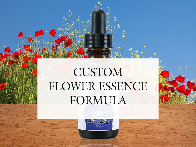 May include: A small glass bottle with a dropper, labeled "Custom Flower Essence Formula". The bottle is sitting on a wooden surface with a field of red poppies in the background.