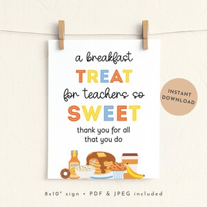 May include: A white sign with the text "a breakfast TREAT for teachers so SWEET" in black, orange, yellow, and blue. The sign includes illustrations of breakfast items and is 8x10 inches. It is held by two wooden clips.