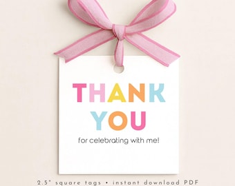 May include: A white square gift tag with the words "THANK YOU" in colourful block letters. The tag is tied with a pink ribbon. The text "for celebrating with me!" is below the main text. The tag is 6.35 cm square.