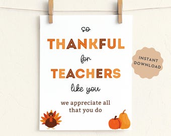 May include: A white sign with the words "SO THANKFUL for TEACHERS like you" in orange and brown lettering. The sign includes illustrations of a turkey, pumpkin, and pear. The sign is 8x10 inches and is held by two wooden clips.