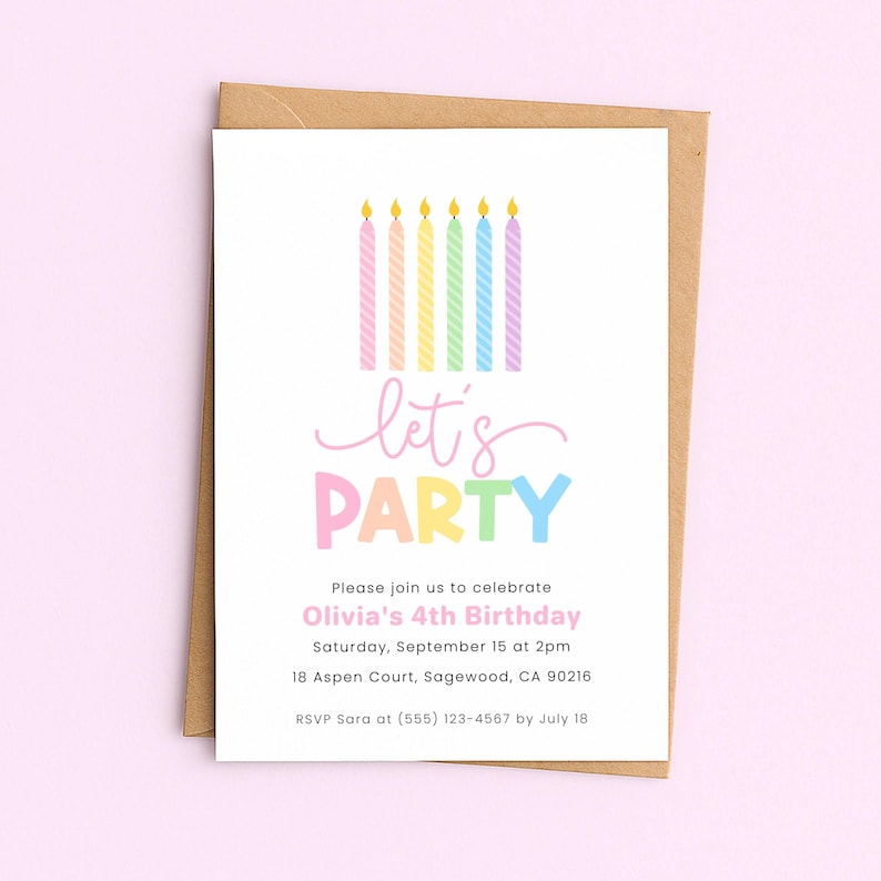 Pastel birthday invitation with rainbow candles and the phrase “Let’s Party,” displayed on a kraft envelope against a soft pink background.