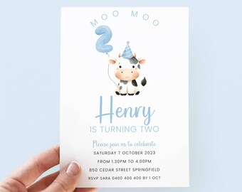 May include: A blue and white birthday invitation featuring a cartoon cow holding a blue number 2 balloon. The text reads "Moo Moo Henry is turning two. Please join us to celebrate Saturday 7 October 2023 from 1.30pm to 4.00pm 850 Cedar Street Springfield RSVP Sara 0400 400 400 by 1 Oct"