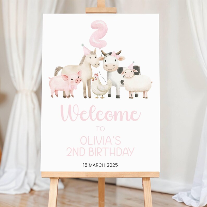 May include: A pink and white welcome sign for a farm-themed birthday party. The sign features a pink number 2 balloon, a horse, a cow, a pig, a chicken, and a sheep. The text on the sign reads "Welcome to Olivia's 2nd Birthday 15 March 2025".
