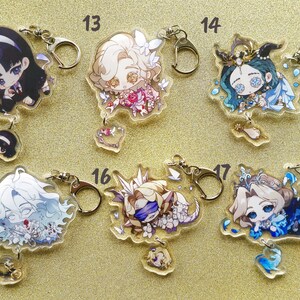 May include: Set of ten colorful anime character keychains. Each keychain features a different character with a unique design and color scheme. The keychains are made of clear acrylic and have a metal ring for attaching to keys or bags.