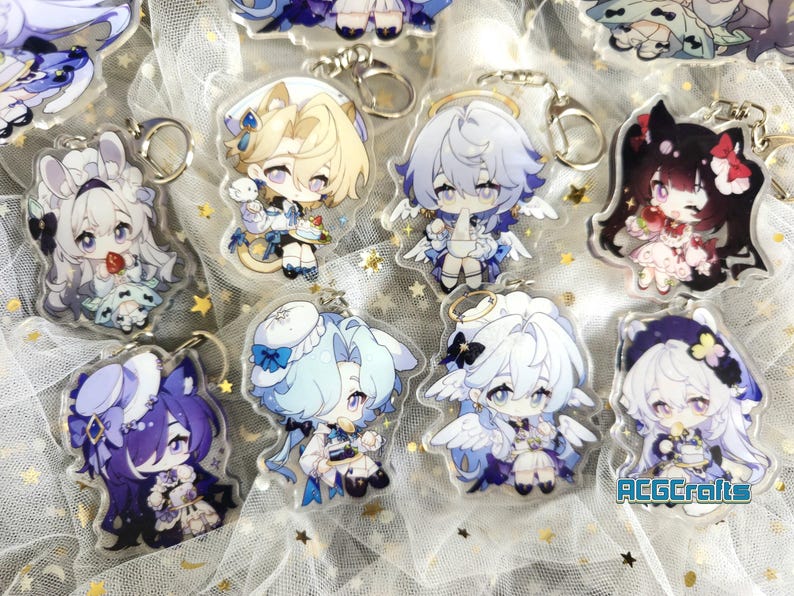 May include: A collection of ten anime character keychains featuring various characters with different colored hair and outfits. The keychains are made of clear acrylic and have a glossy finish. The keychains are displayed on a white background with a silver glitter overlay.
