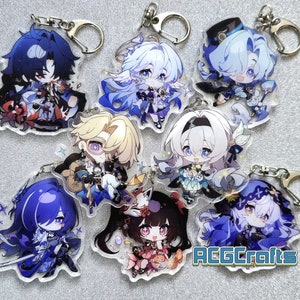 Op de afbeelding: Een set van acht anime-personage sleutelhangers met verschillende personages met blauw, wit en paars haar. De sleutelhangers zijn gemaakt van helder acryl en hebben een glittereffect. De personages zijn allemaal in chibi-stijl en hebben grote ogen. De sleutelhangers zijn bevestigd aan zilveren sleutelringen. De tekst "ACGcrafts" is zichtbaar in de rechterbenedenhoek van de afbeelding.