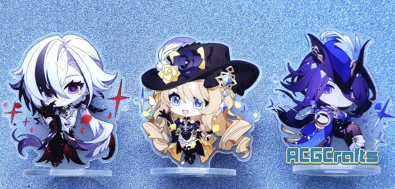 May include: Three anime character acrylic stands. The characters are a white-haired male with red eyes, a blonde female with blue eyes, and a purple-haired male with blue eyes. The stands are on a blue background.