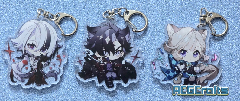 May include: Three anime-style character keychains with glitter accents. The characters are a white-haired male with purple eyes, a black-haired male with purple eyes, and a blonde-haired female with purple eyes. Each keychain has a silver metal ring.