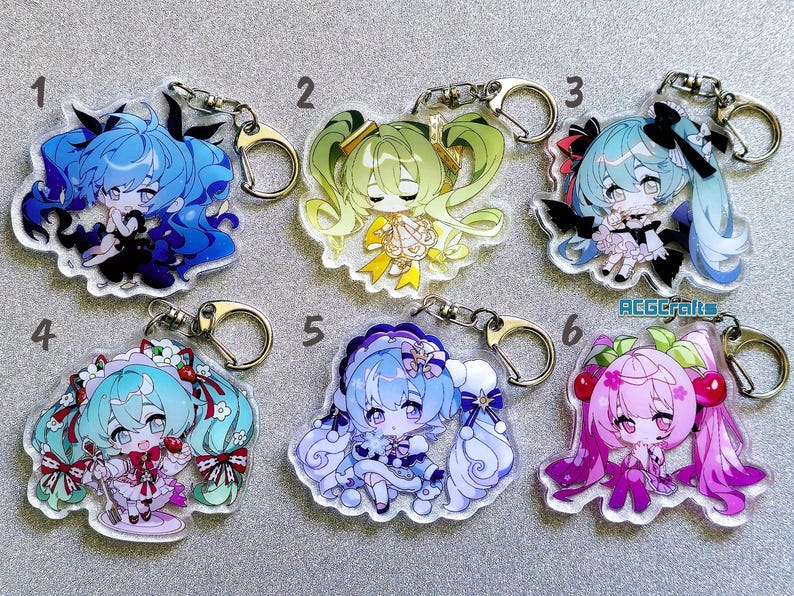 May include: Six colorful keychains featuring anime-style characters with long hair and different outfits. The keychains are made of clear acrylic and have silver metal key rings.