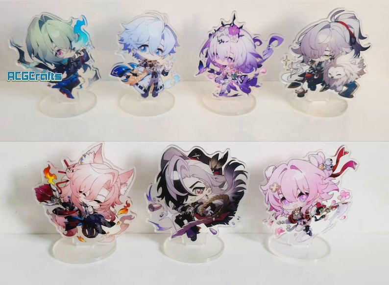 May include: Set of 8 acrylic character stands featuring anime characters with various hairstyles and outfits. The stands are clear and have a circular base.