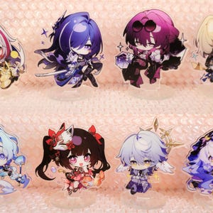 May include: Set of ten acrylic character standees featuring anime characters with colourful hair and clothing. The standees are on a pink and white background. The text "ACGCrafts" appears in the bottom right corner of the image.
