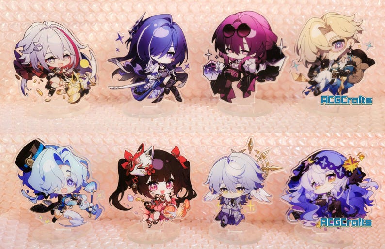 May include: Set of ten acrylic character standees featuring anime characters with colourful hair and clothing. The standees are on a pink and white background. The text "ACGCrafts" appears in the bottom right corner of the image.