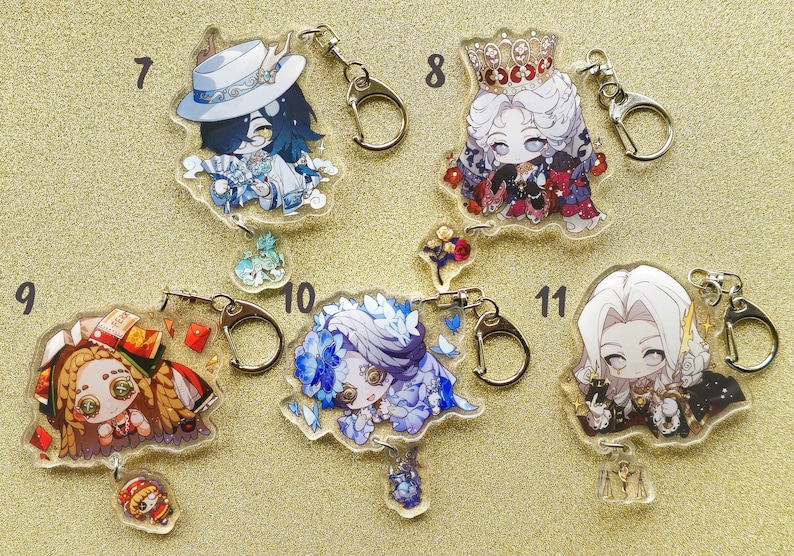 May include: Ten colorful anime character keychains with clear plastic backgrounds. Each keychain features a different character with unique details and accessories. The keychains are attached to silver key rings.