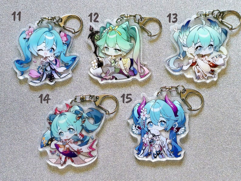 May include: Set of ten colorful anime character keychains with different designs. Each keychain features a different character with blue hair and a unique outfit. The keychains are made of clear acrylic and have a metal ring for attaching to keys or bags.