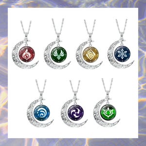 May include: A collection of seven silver-toned necklaces. Each necklace features a crescent moon pendant with a circular charm displaying a unique symbol in various colors, including red, green, and blue. The necklaces are displayed against a soft, blurred background.