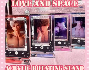 May include: Acrylic rotating stands featuring images of male figures. Each stand has a rectangular frame with a digital media player interface. The stands are in various colors, including red, pink, and blue. The text "LOVE AND SPACE" and "ACRYLIC ROTATING STAND" are visible.