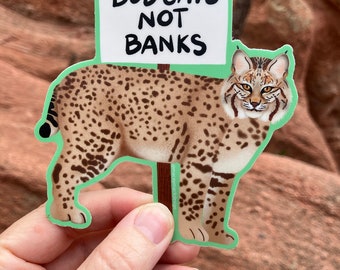 Animal Activist Bob Cat Sticker on Turquoise Background, Protest Sign, Endangered Species