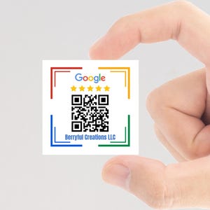 May include: A white card with a red, green, blue, and yellow border. The card has a Google logo with five yellow stars, a black and white QR code, and the text "Berryful Creations LLC".