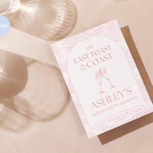 May include: Pink and white invitation with a palm leaf design. The text reads "The Last Toast on the Coast Ashley's Bachelorette Weekend May 25-27, 2024 Watercolor, FL"