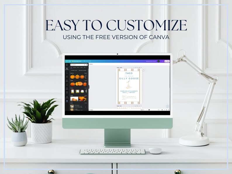 May include: A computer screen displaying a Canva design template for a birthday invitation. The template features a blue and white striped background with the text "Theo is turning 1 Silly Goose". The screen is on a white desk with a plant and a lamp.