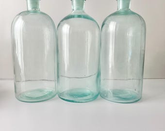 Grote antieke apothekersfles van Graselli Chemical Co. met stop