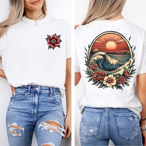 May include: White t-shirt with a red flower on the left chest and a vintage-style illustration of a wave, sun, and flowers on the back.