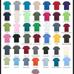 May include: Color chart showing 30 different t-shirt colors. The colors are arranged in rows and columns, with each color labeled with its name. The colors include tropical blue, sport grey, sapphire blue, sand, royal blue, red, purple, navy, natural, mint green, military green, heliconia, maroon, lime green, kiwi, light pink, jade dome, irish green, white, indigo, antique cherry red, azalea, black, heather military green, cardinal red, heather royal, daisy, dark chocolate, heather navy, charcoal, cherry red, graphite heather, forest green, dark heather, off white, pistachio, sky blue, stone blue, orange, light blue, antique sapphire, carolina blue, and paragon.