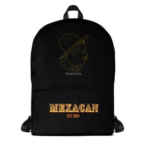 May include: Black backpack featuring a gold outline of a man in a hat, with the text "Division del Norte" above. Below, the backpack displays the word "MEXACAN" in a gold and red gradient, with "EST 2024" underneath.