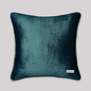Handcrafted teal velvet cushion cover 45x45cm, luxury square pillow with smooth finish and decorative cord trim, stylish couch pillow for home interior design.