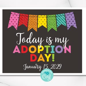 May include: A black and white printable sign with a rainbow banner at the top. The sign says "Today is my Adoption Day!" with the date "January 15, 2029" below.