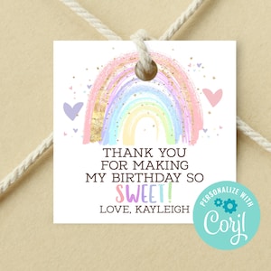 May include: A rainbow-colored thank you tag with gold glitter accents and a pink heart. The text reads "Thank you for making my birthday so sweet! Love, Kayleigh". The tag is personalized with "Coril".