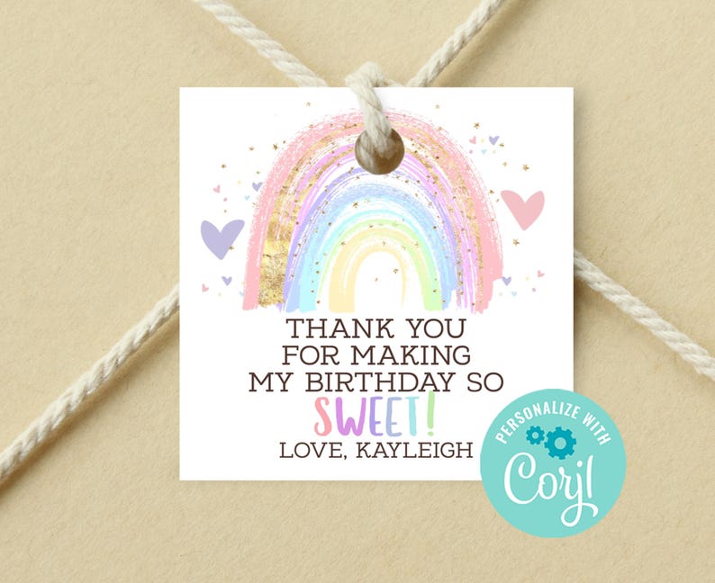 May include: A rainbow-colored thank you tag with gold glitter accents and a pink heart. The text reads "Thank you for making my birthday so sweet! Love, Kayleigh". The tag is personalized with "Coril".