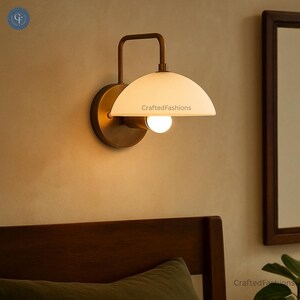 1-light wall fixture with Mid Century Modern Raw Brass Sputnik design, sleek style