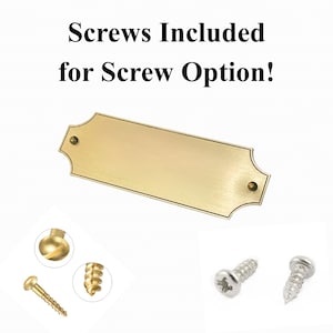 May include: A rectangular brass-colored metal plaque with decorative scalloped edges and two mounting holes. The text "Screws Included for Screw Option!" is displayed above. Two gold-toned screws and two silver-toned screws are shown below.